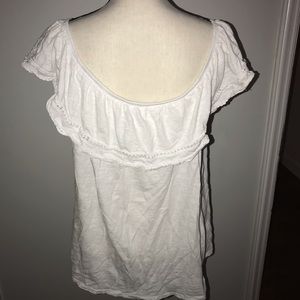 Flowing off the shoulder tunic